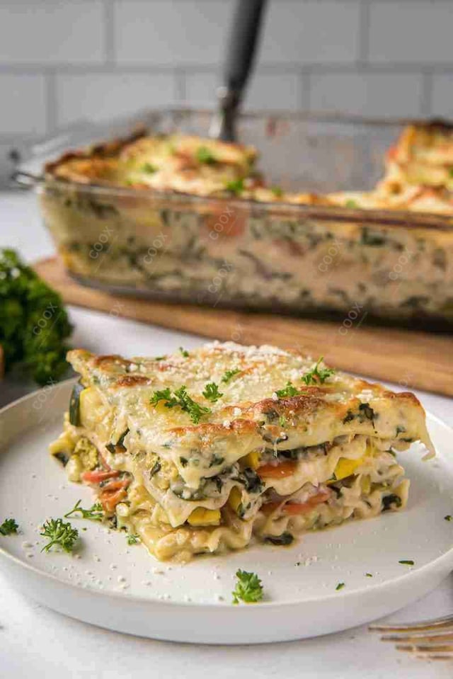 Tasty Veg Lasagna cooked by COOX chefs cooks during occasions parties events at home