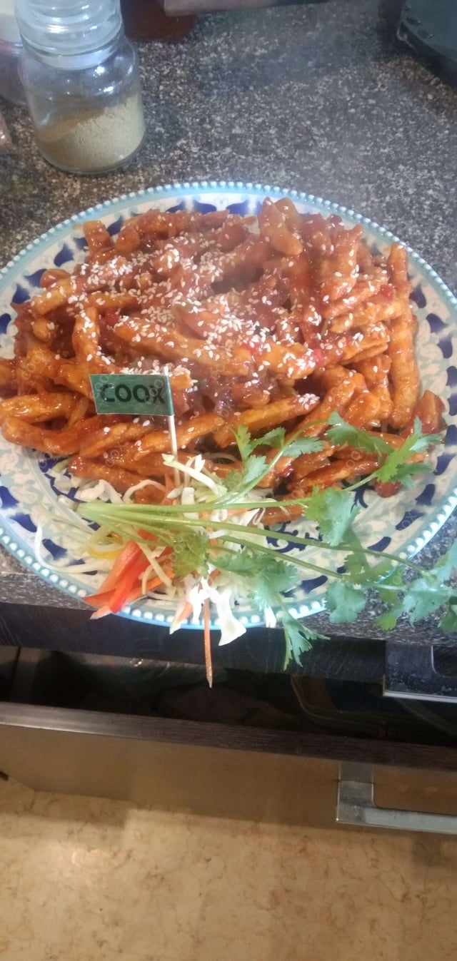 Tasty Honey Chilli Potato cooked by COOX chefs cooks during occasions parties events at home