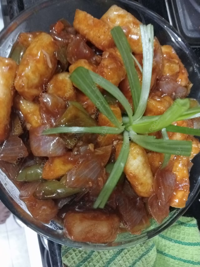 Tasty Chilli Paneer (Gravy) cooked by COOX chefs cooks during occasions parties events at home