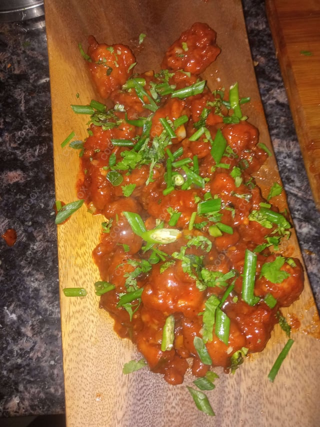 Tasty Chicken Manchurian (Dry) cooked by COOX chefs cooks during occasions parties events at home