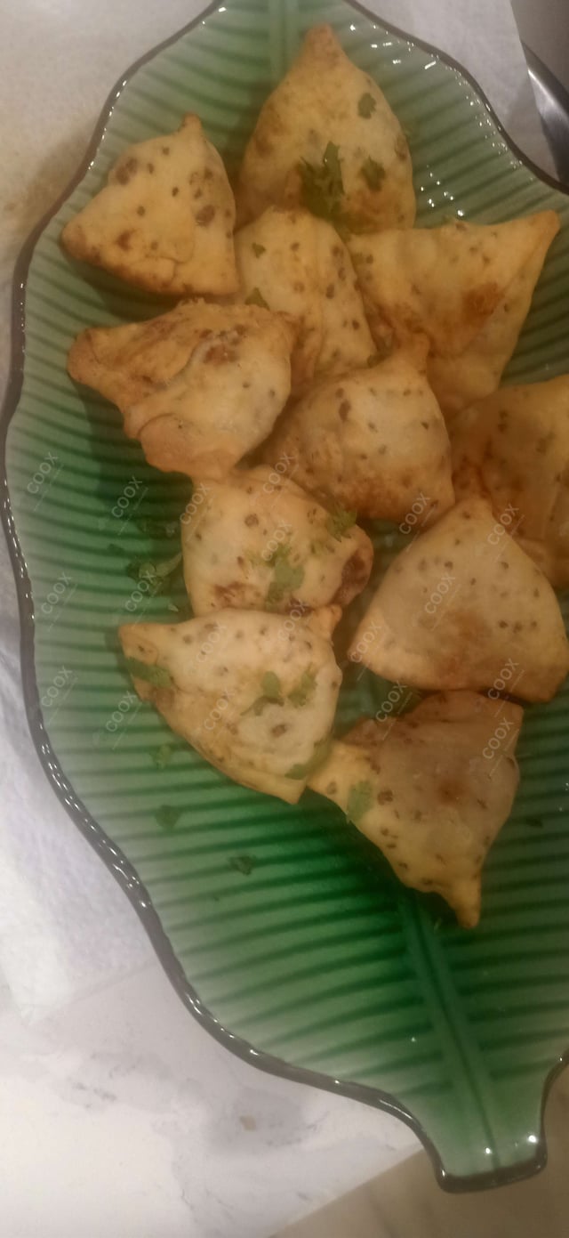 Tasty Mini Samosas cooked by COOX chefs cooks during occasions parties events at home