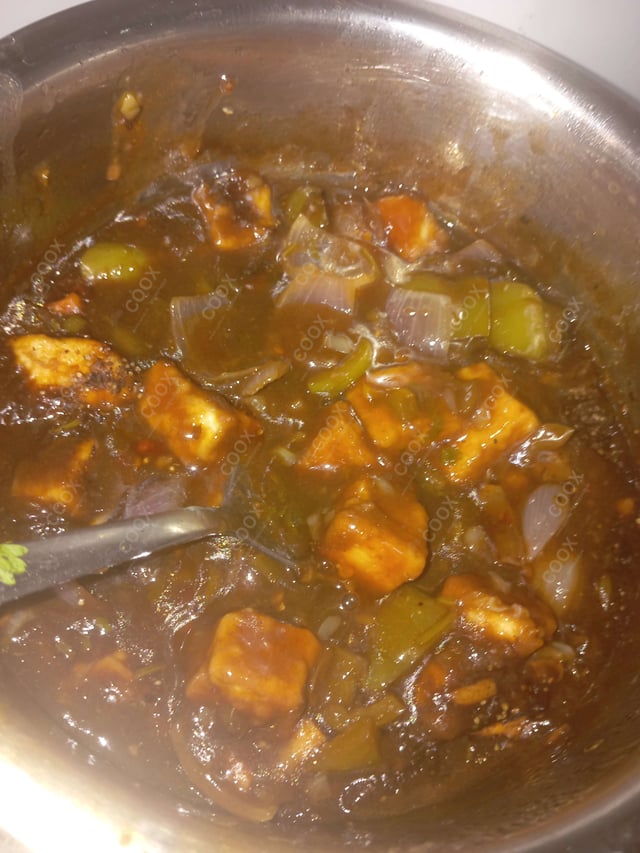 Tasty Chilli Paneer (Gravy) cooked by COOX chefs cooks during occasions parties events at home