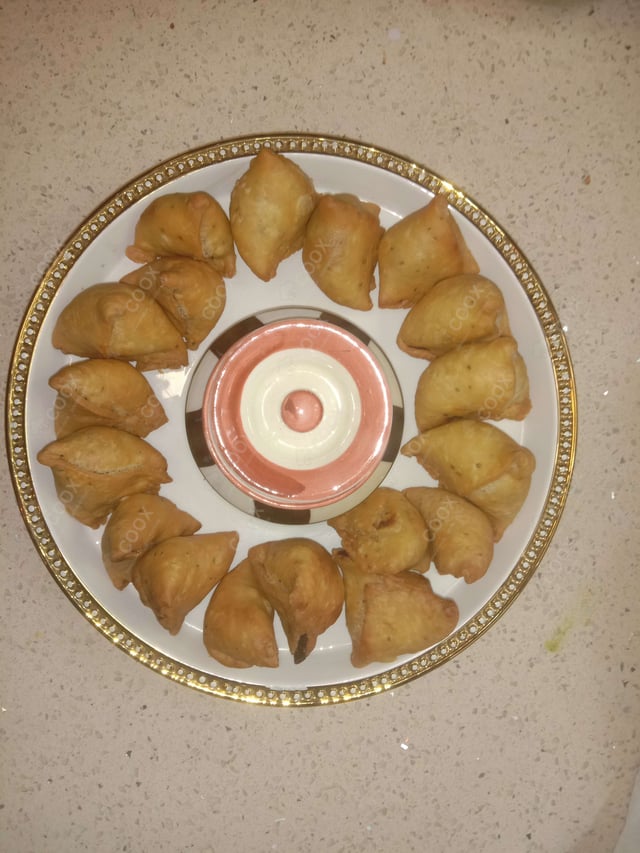 Tasty Mini Samosas cooked by COOX chefs cooks during occasions parties events at home