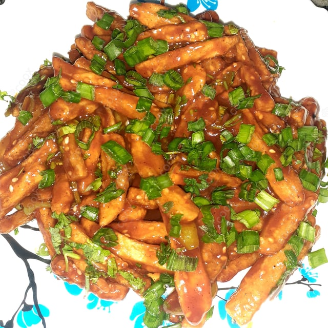 Tasty Honey Chilli Potato cooked by COOX chefs cooks during occasions parties events at home