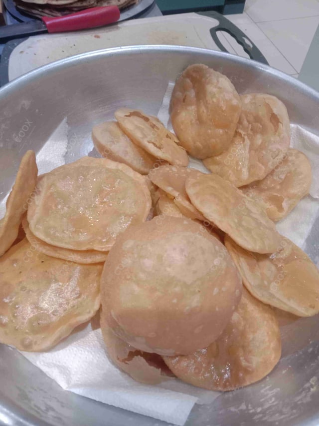 Delicious Pooris & Bedmis prepared by COOX