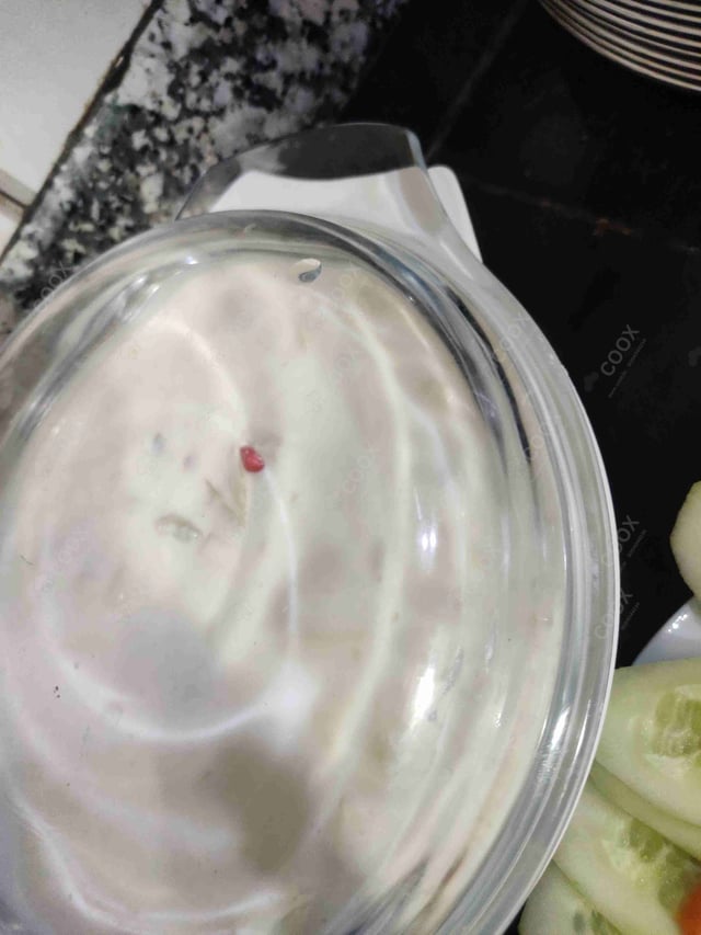 Tasty Mix Fruit Raita cooked by COOX chefs cooks during occasions parties events at home