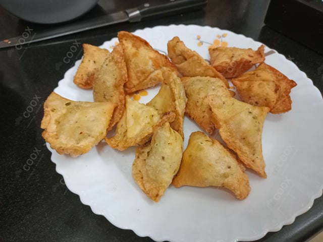 Tasty Mini Samosas cooked by COOX chefs cooks during occasions parties events at home