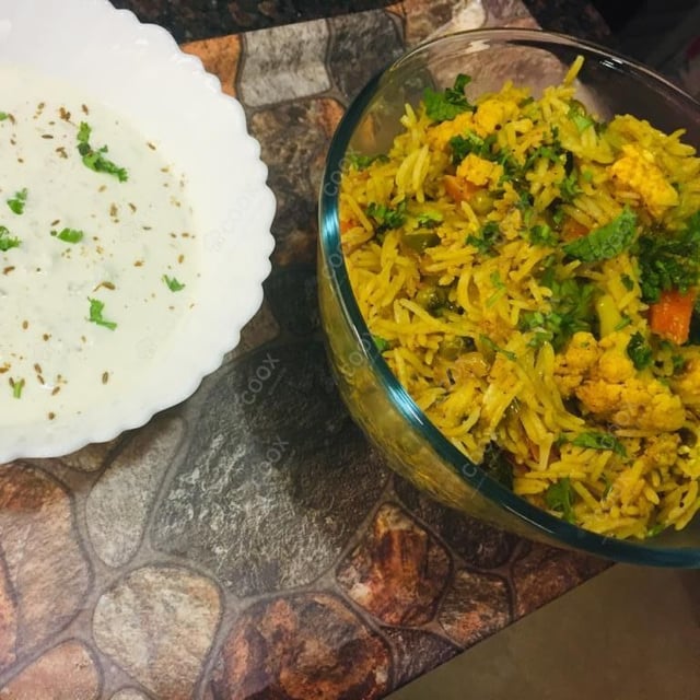Tasty Veg Biryani cooked by COOX chefs cooks during occasions parties events at home
