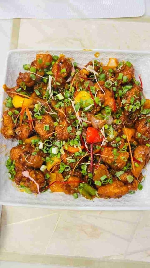 Tasty Chilli Paneer (Gravy) cooked by COOX chefs cooks during occasions parties events at home