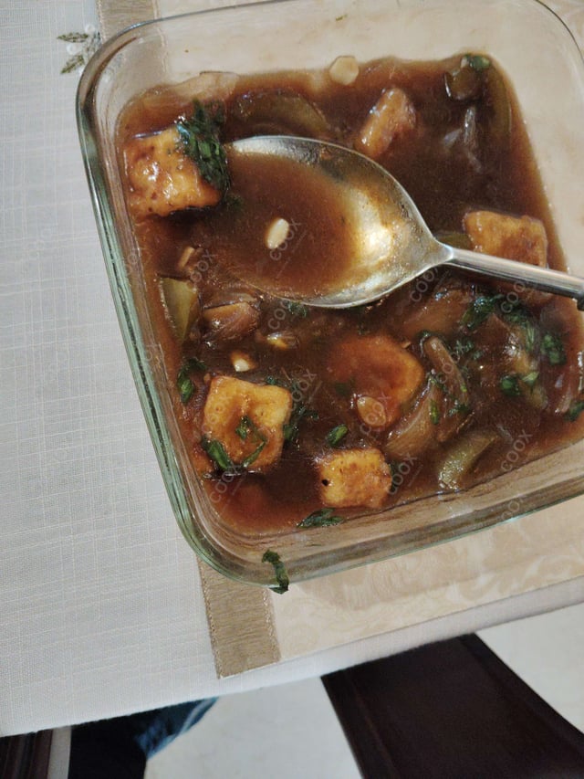 Tasty Chilli Paneer (Gravy) cooked by COOX chefs cooks during occasions parties events at home