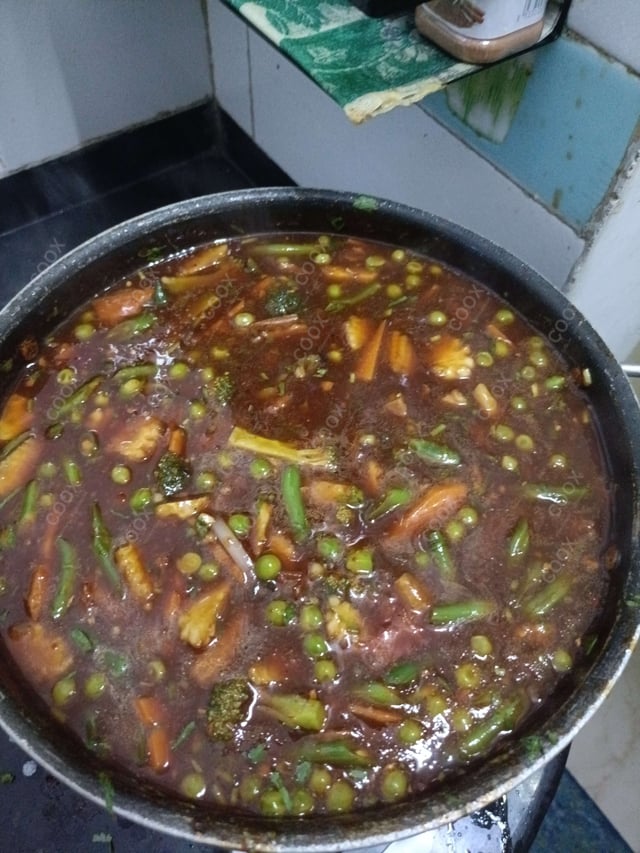 Tasty Mix Veg in Schezwan Sauce cooked by COOX chefs cooks during occasions parties events at home