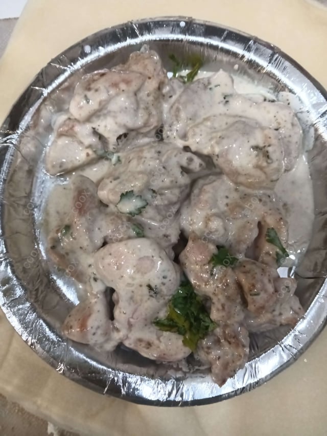 Delicious Murgh Malai Tikka prepared by COOX