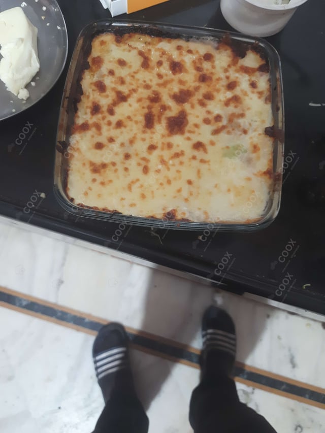 Tasty Veg Lasagna cooked by COOX chefs cooks during occasions parties events at home