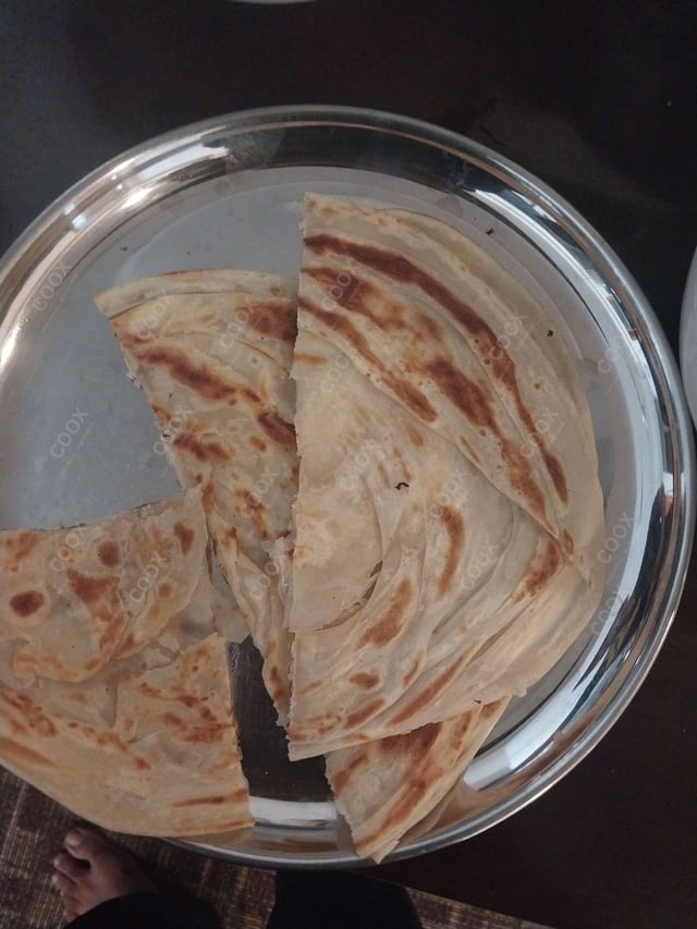 Tasty Malabar Parotta cooked by COOX chefs cooks during occasions parties events at home