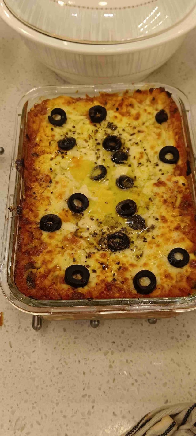 Tasty Veg Lasagna cooked by COOX chefs cooks during occasions parties events at home