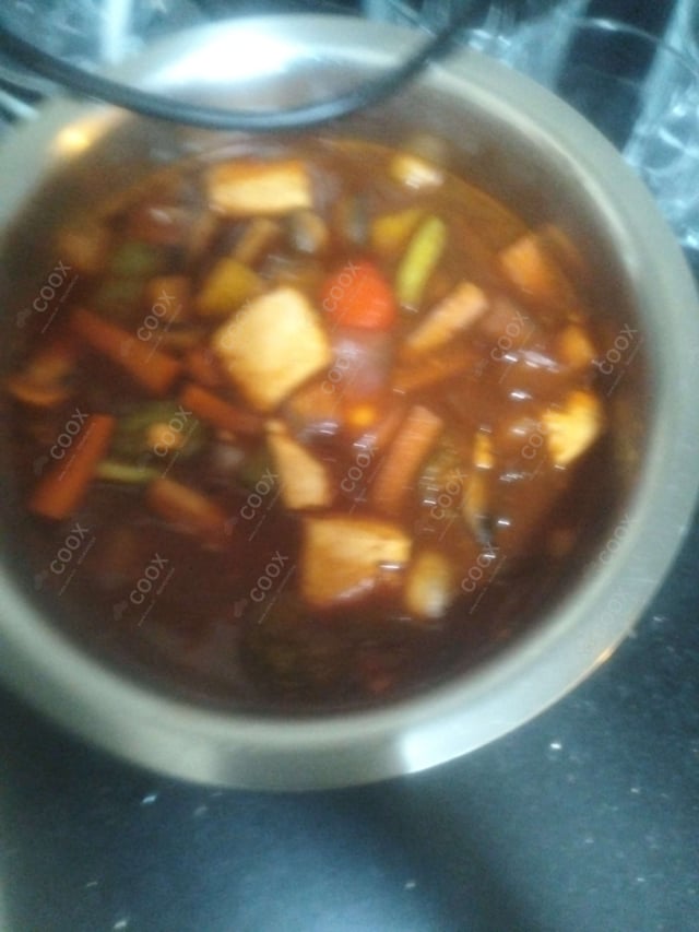 Tasty Chilli Paneer (Gravy) cooked by COOX chefs cooks during occasions parties events at home