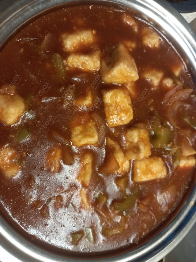 Tasty Chilli Paneer (Gravy) cooked by COOX chefs cooks during occasions parties events at home