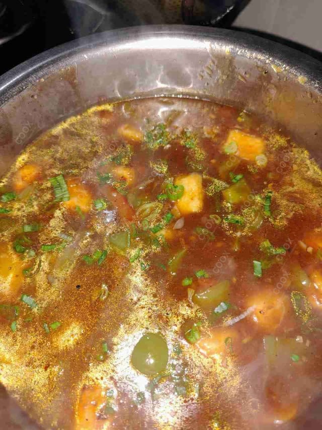 Tasty Chilli Paneer (Gravy) cooked by COOX chefs cooks during occasions parties events at home