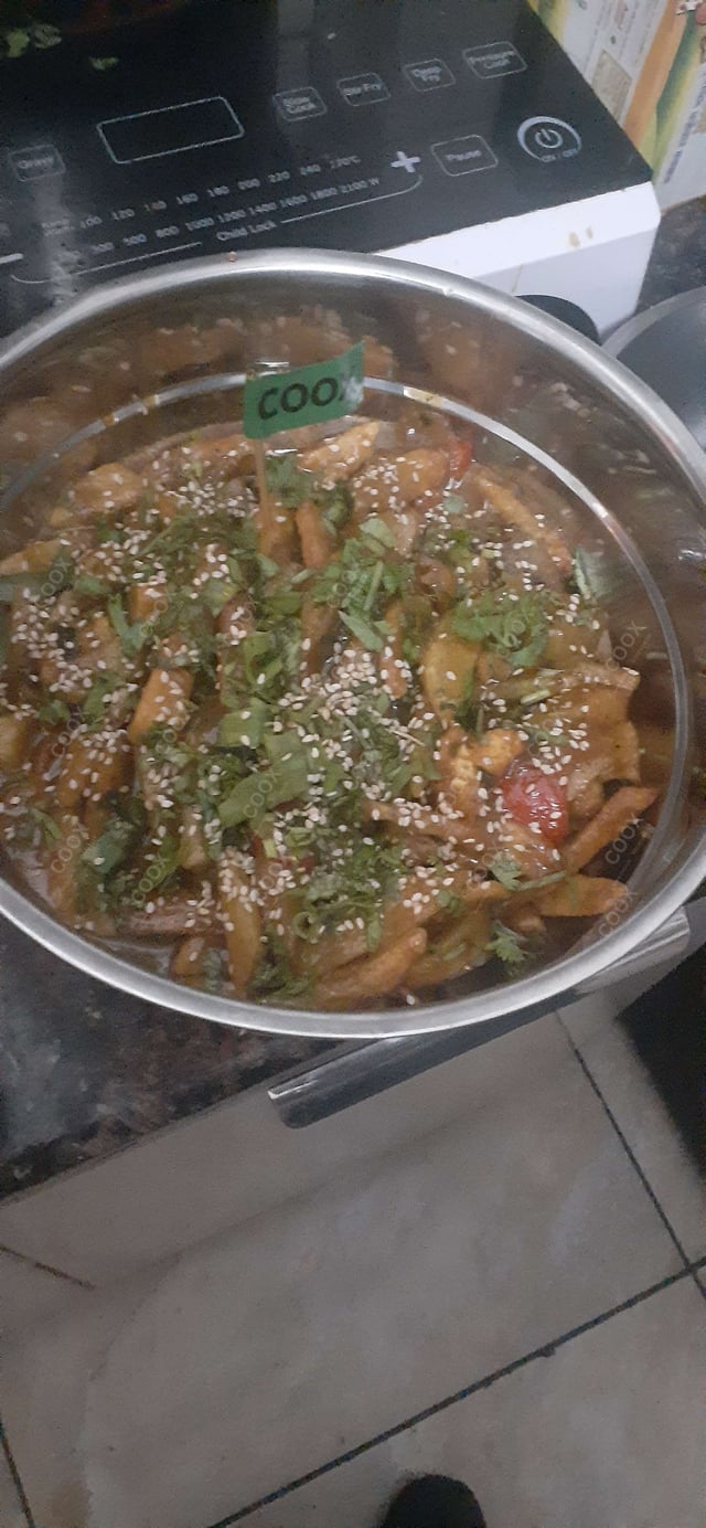 Tasty Honey Chilli Potato cooked by COOX chefs cooks during occasions parties events at home