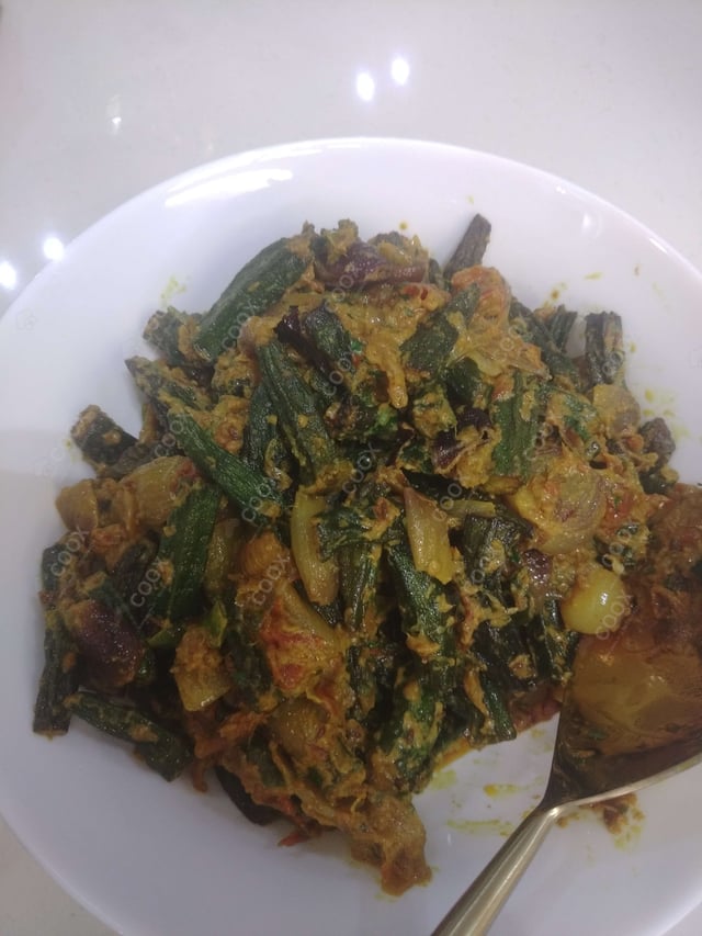 Tasty Bhindi do Pyaza cooked by COOX chefs cooks during occasions parties events at home