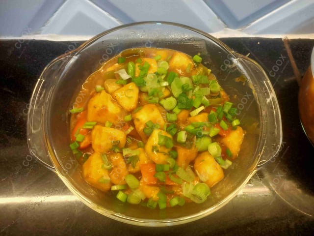 Tasty Chilli Paneer (Gravy) cooked by COOX chefs cooks during occasions parties events at home