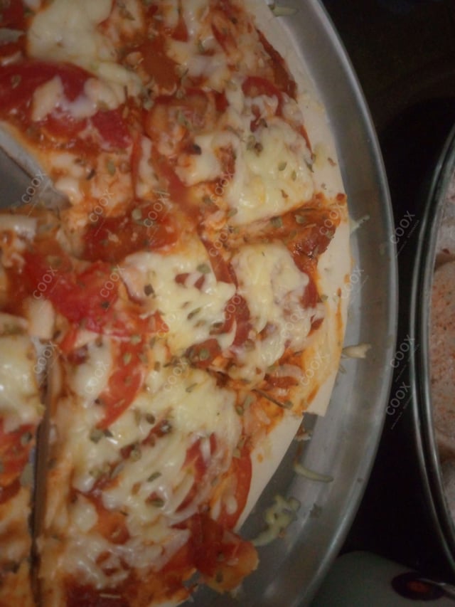 Tasty Margherita Pizza cooked by COOX chefs cooks during occasions parties events at home