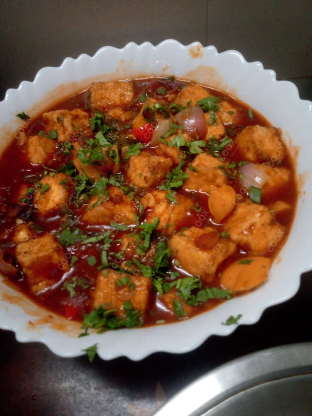 Tasty Chilli Paneer (Gravy) cooked by COOX chefs cooks during occasions parties events at home
