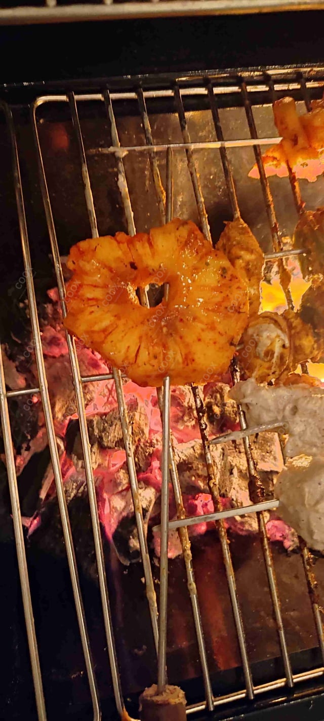 Tasty Tandoori Pineapple cooked by COOX chefs cooks during occasions parties events at home