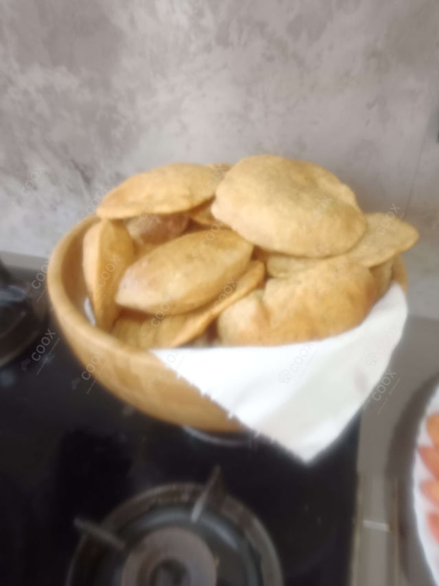 Delicious Pooris & Bedmis prepared by COOX