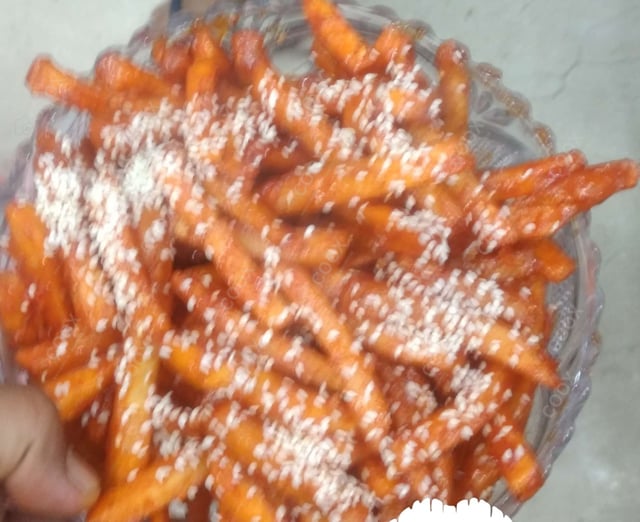 Tasty Honey Chilli Potato cooked by COOX chefs cooks during occasions parties events at home