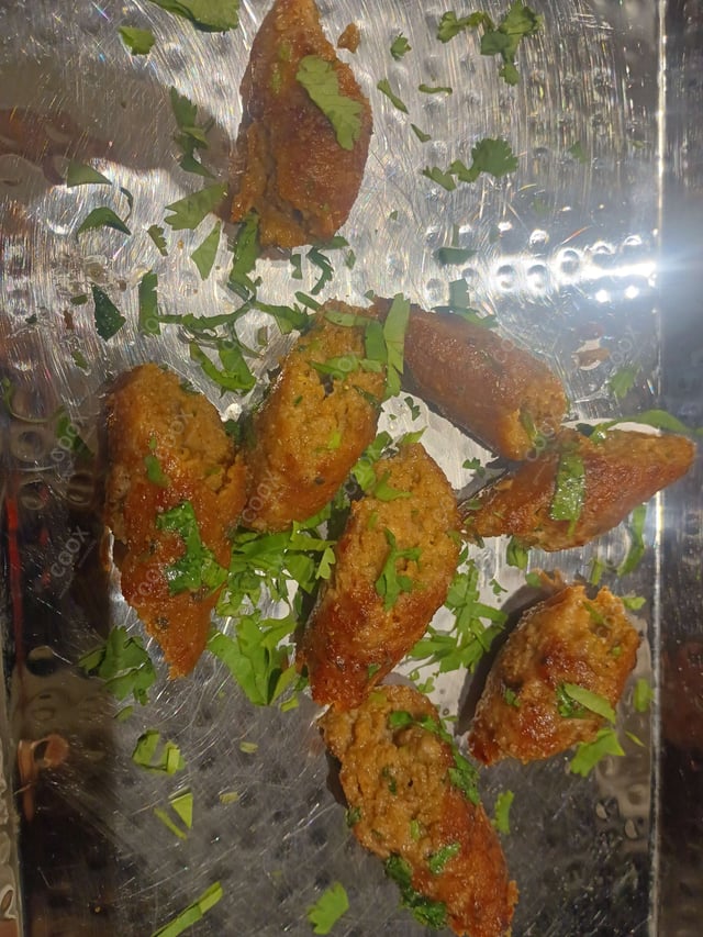 Delicious Mutton Seekh Kebab prepared by COOX