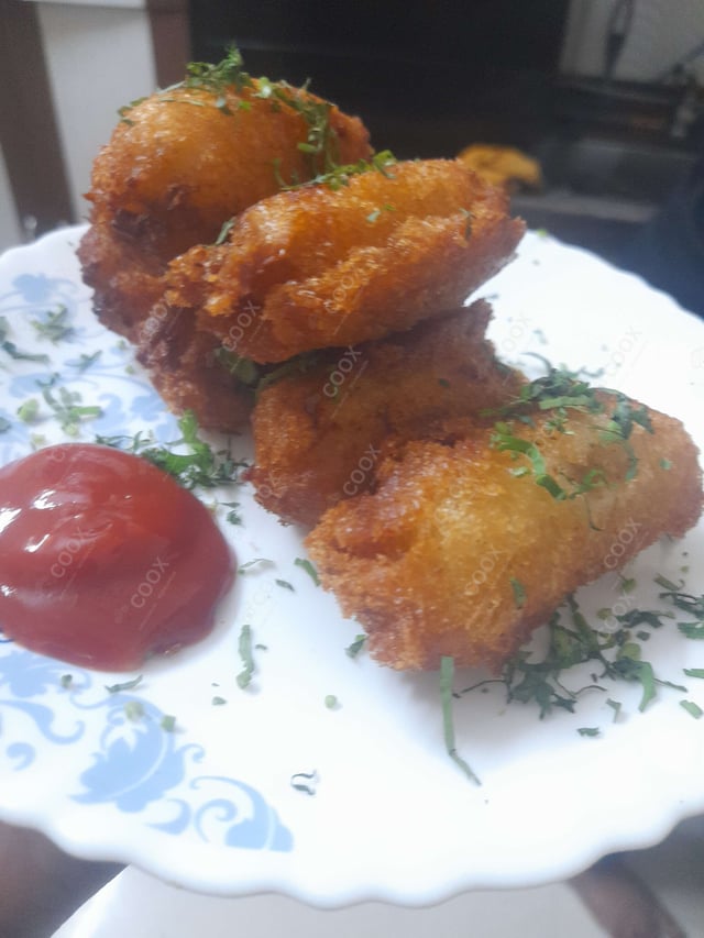 Delicious Dahi ke Sholey prepared by COOX