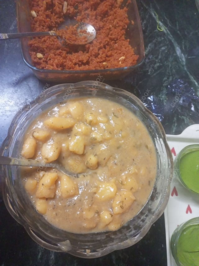 Delicious Aloo Rasedar prepared by COOX