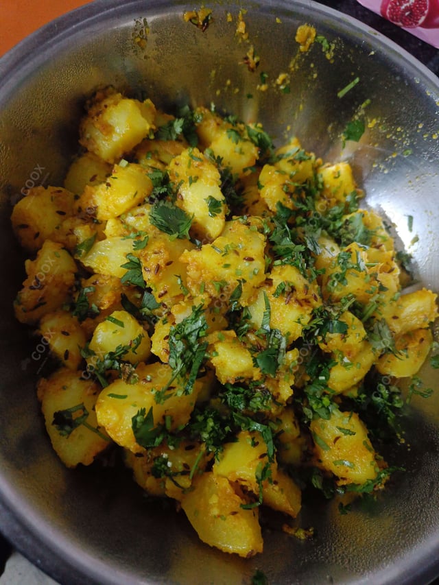 Delicious Jeera Aloo prepared by COOX
