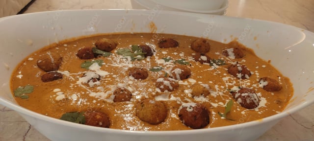 Delicious Malai Kofta (Orange Gravy) prepared by COOX