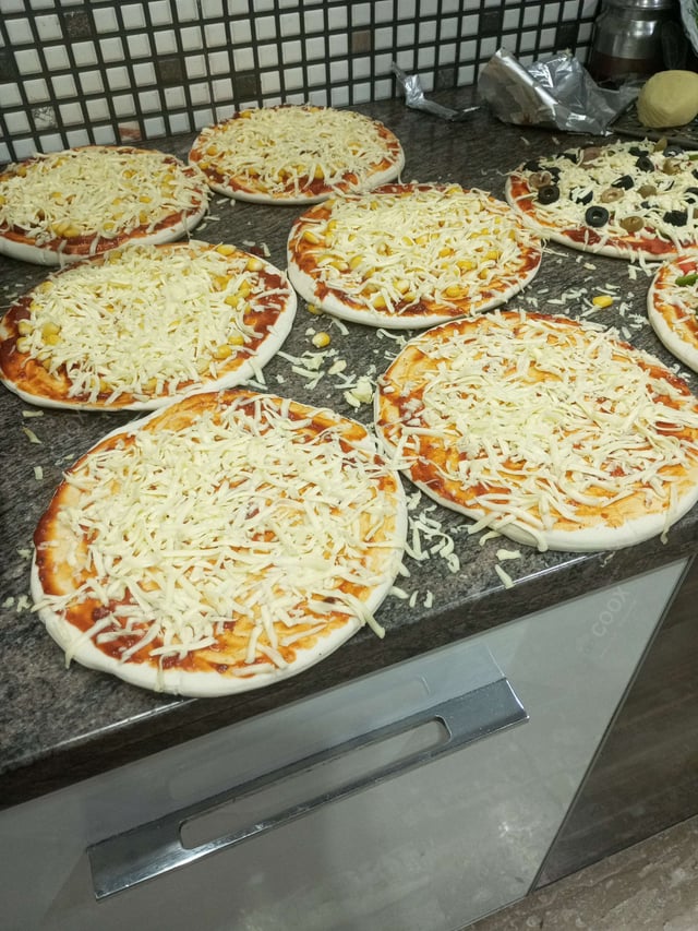 Tasty Margherita Pizza cooked by COOX chefs cooks during occasions parties events at home