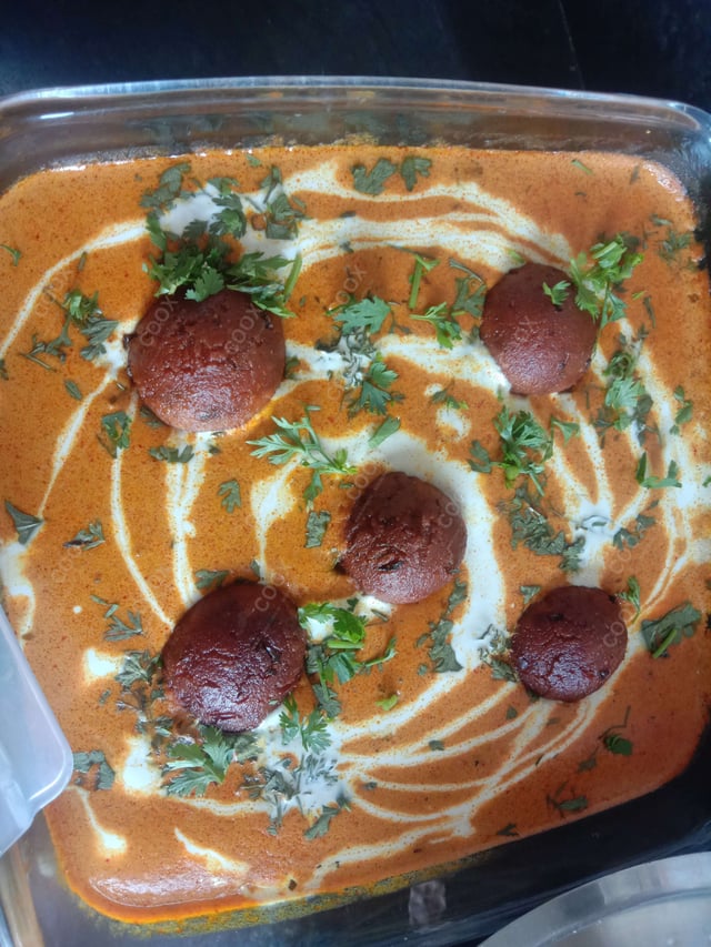 Delicious Malai Kofta (Orange Gravy) prepared by COOX