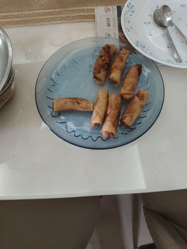 Delicious Veg Spring Rolls prepared by COOX