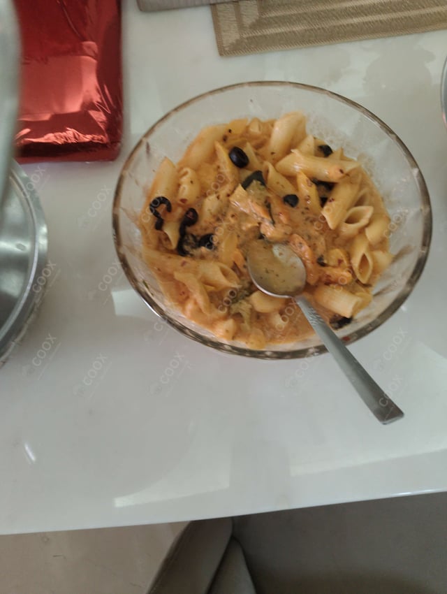 Delicious Ravioli in Pink Sauce prepared by COOX