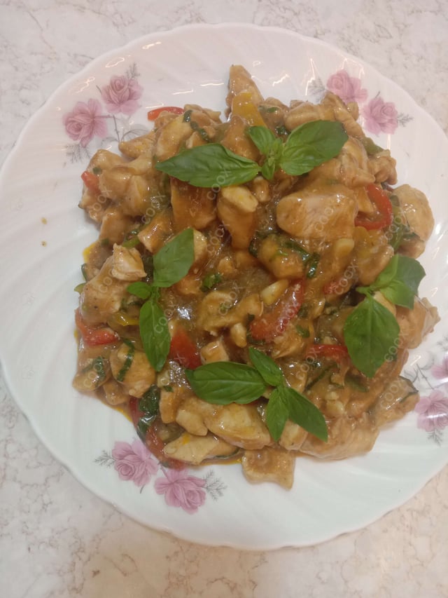 Tasty Thai Basil Chicken cooked by COOX chefs cooks during occasions parties events at home