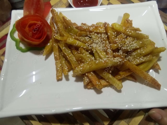 Tasty Honey Chilli Potato cooked by COOX chefs cooks during occasions parties events at home