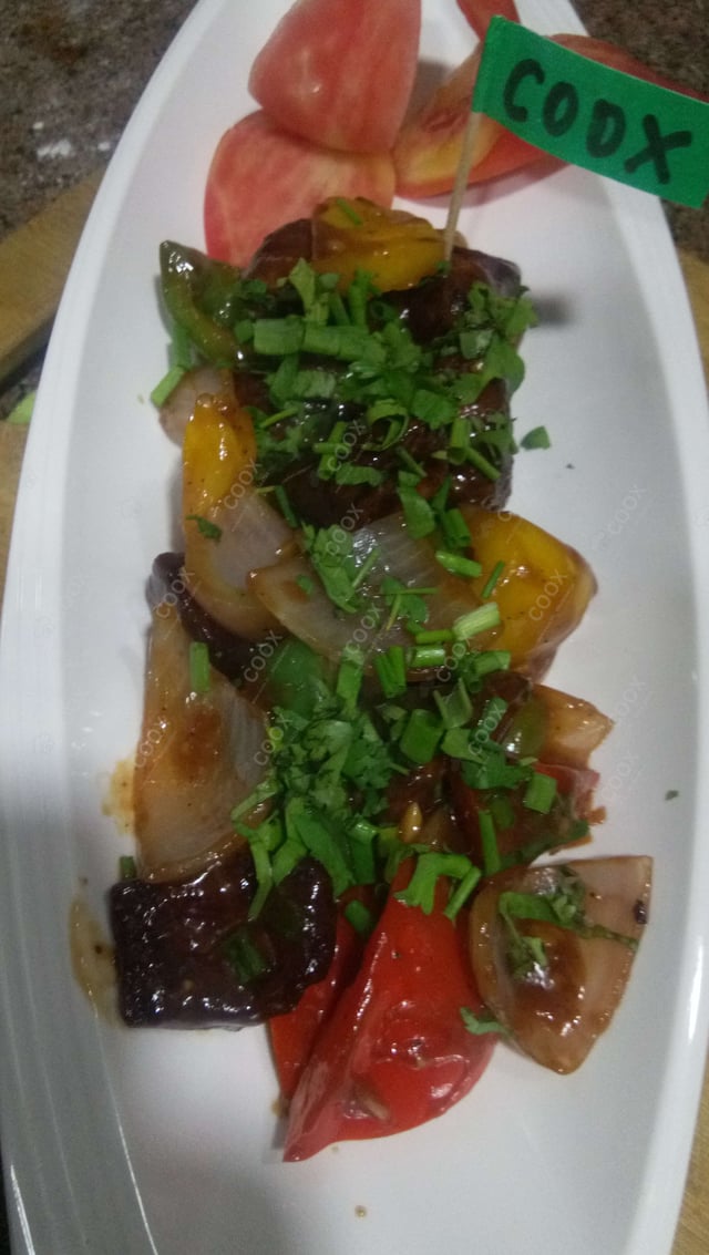 Tasty Chilli Paneer (Dry) cooked by COOX chefs cooks during occasions parties events at home