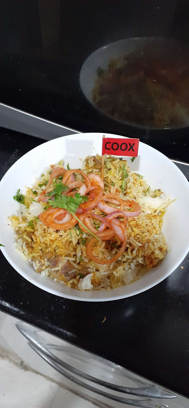 Tasty Mutton Biryani cooked by COOX chefs cooks during occasions parties events at home