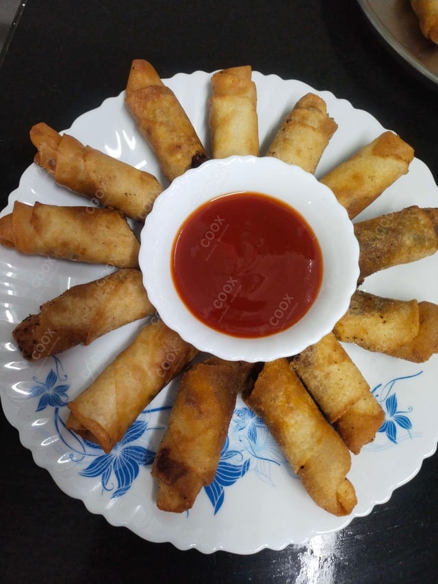 Delicious Chicken Spring Rolls prepared by COOX