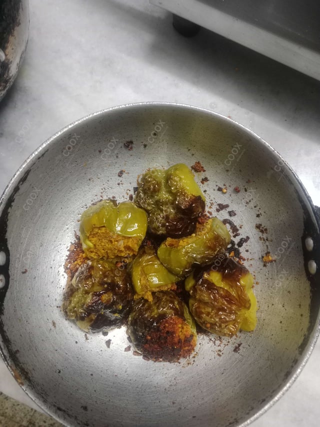 Tasty Bharwa Shimla Mirch cooked by COOX chefs cooks during occasions parties events at home