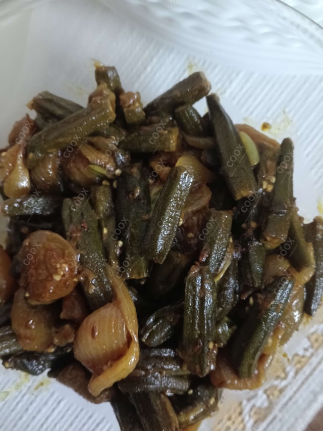 Tasty Bhindi do Pyaza cooked by COOX chefs cooks during occasions parties events at home
