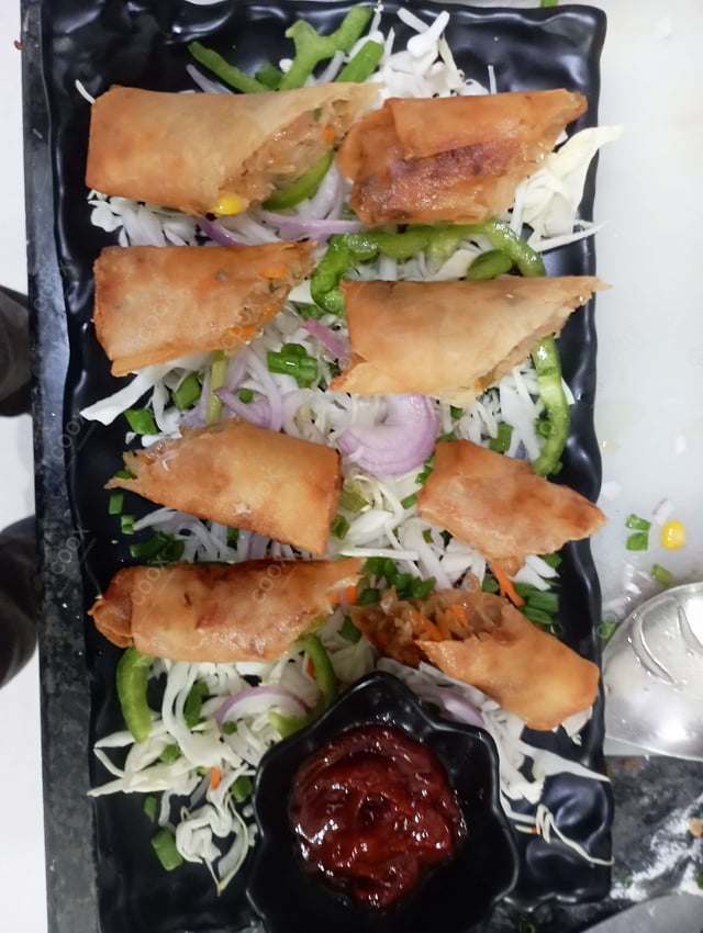 Delicious Veg Spring Rolls prepared by COOX
