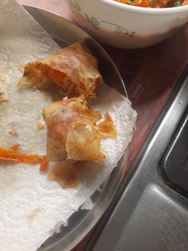 Delicious Veg Spring Rolls prepared by COOX