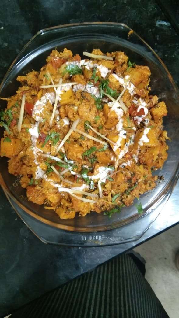 Tasty Aloo Gobhi cooked by COOX chefs cooks during occasions parties events at home