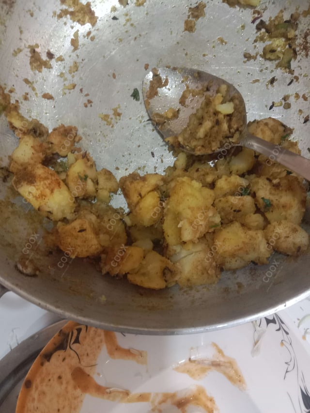 Delicious Jeera Aloo prepared by COOX